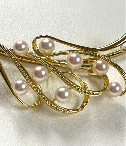 Akoya pearl silver choker necklace with gold color accents and matching brooch measuring 66mm by 30mm