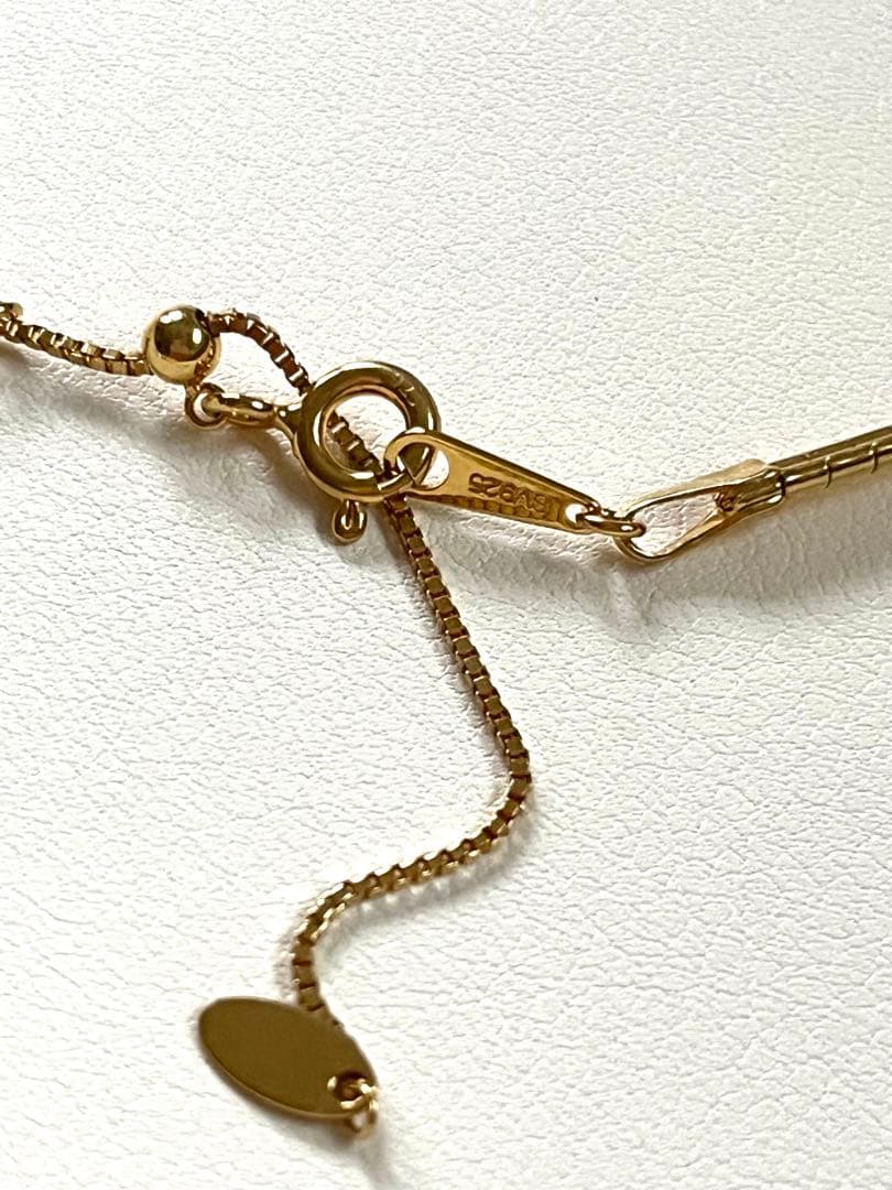 Akoya pearl silver choker necklace with gold color accents and matching brooch measuring 66mm by 30mm