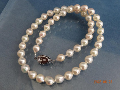 Akoya Pearl Necklace featuring 7-7.5mm baroque pearls in white, pink, blue, and cream colors with one-touch clasp