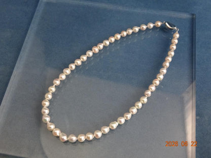 Akoya Pearl Necklace featuring 7-7.5mm baroque pearls in white, pink, blue, and cream colors with one-touch clasp