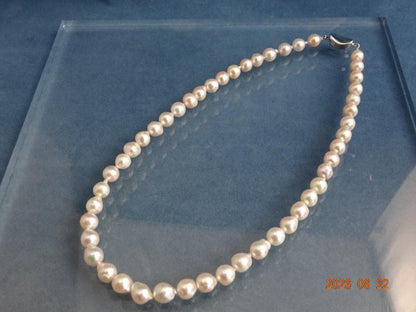 Akoya Pearl Necklace featuring 7-7.5mm baroque pearls in white, pink, blue, and cream colors with one-touch clasp