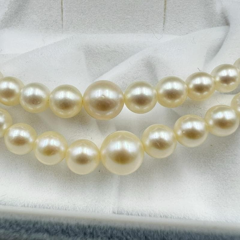 Mikimoto silver double strand necklace featuring gradated Akoya pearls sized 3.5-7.5 mm, 40 cm long