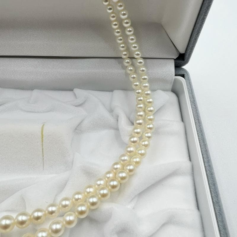Mikimoto silver double strand necklace featuring gradated Akoya pearls sized 3.5-7.5 mm, 40 cm long
