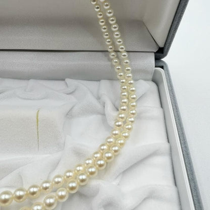Mikimoto silver double strand necklace featuring gradated Akoya pearls sized 3.5-7.5 mm, 40 cm long