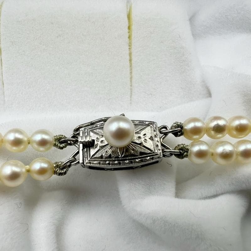 Mikimoto silver double strand necklace featuring gradated Akoya pearls sized 3.5-7.5 mm, 40 cm long
