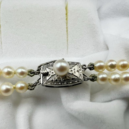 Mikimoto silver double strand necklace featuring gradated Akoya pearls sized 3.5-7.5 mm, 40 cm long