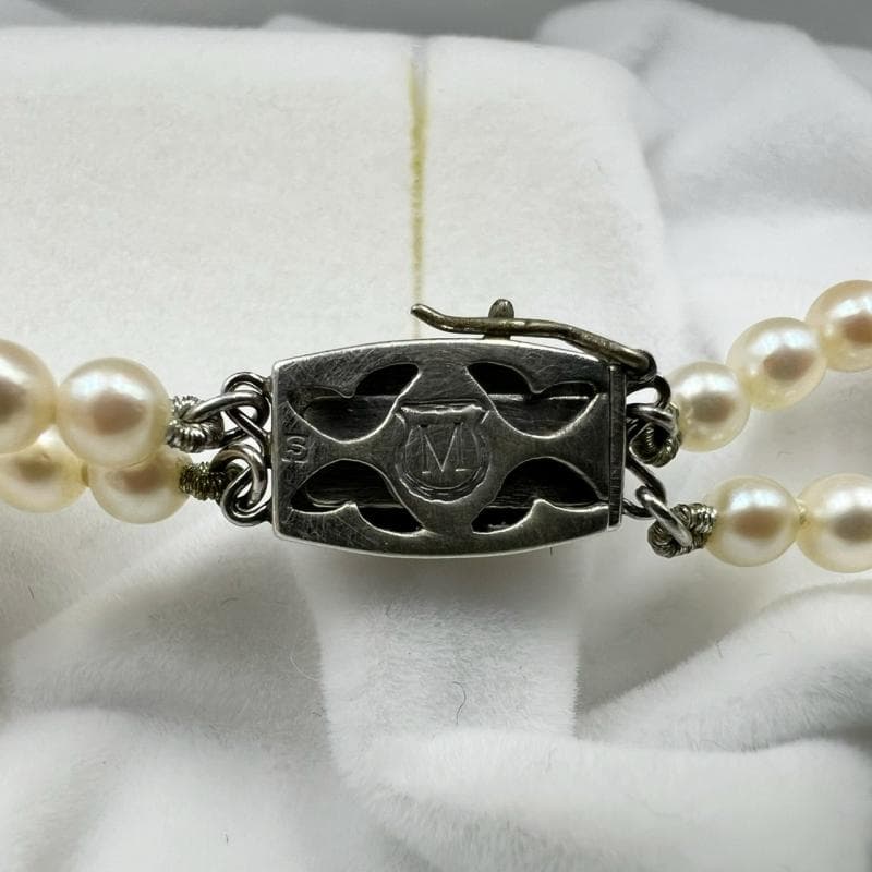 Mikimoto silver double strand necklace featuring gradated Akoya pearls sized 3.5-7.5 mm, 40 cm long