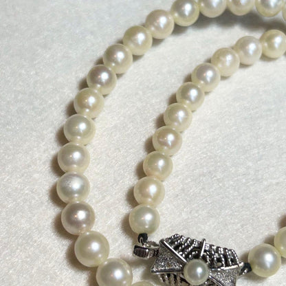 Akoya pearl necklace featuring 7mm to 6.5mm pearls on a 40cm strand with silver stamp