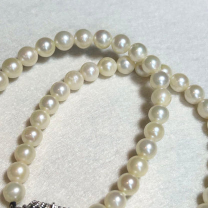 Akoya pearl necklace featuring 7mm to 6.5mm pearls on a 40cm strand with silver stamp