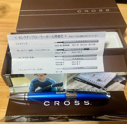Kuro Cross rollerball pen in blue with included refill, showing a classic design