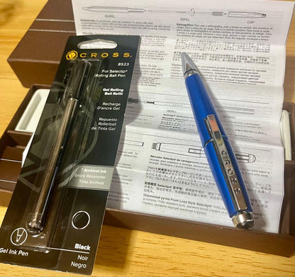 Kuro Cross rollerball pen in blue with included refill, showing a classic design