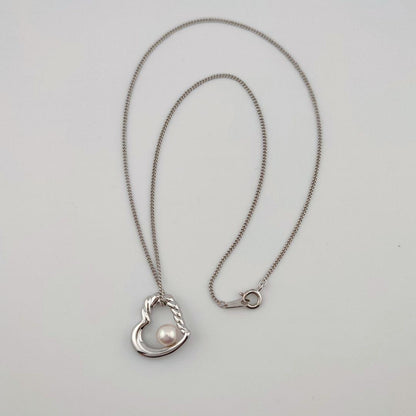 TASAKI Open Heart Pearl Necklace in silver with a 6.3mm round pearl pendant