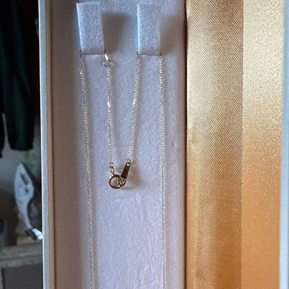 18k gold necklace with 0.2ct diamond and 8.5mm Akoya pearl on a white background
