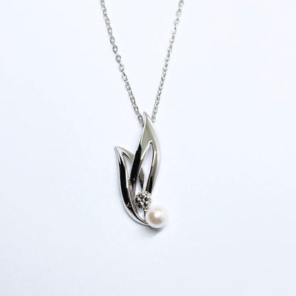 MIKIMOTO Baby Pearl Necklace with 5.1mm pearls and chrysanthemum mon pendant on silver chain