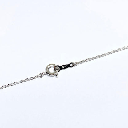MIKIMOTO Baby Pearl Necklace with 5.1mm pearls and chrysanthemum mon pendant on silver chain