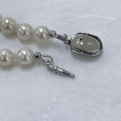 Akoya pearl semi-long necklace measuring 60cm with 7 to 7.5mm pearls and a silver 925 insert clasp with inscription