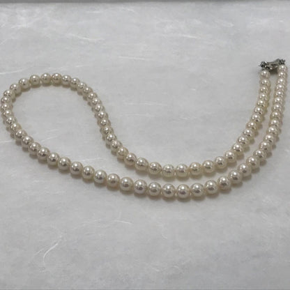 Akoya pearl semi-long necklace measuring 60cm with 7 to 7.5mm pearls and a silver 925 insert clasp with inscription