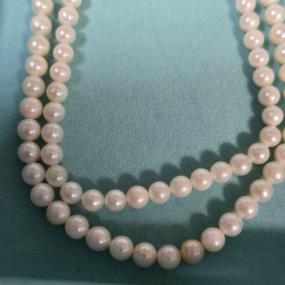 Long Akoya pearl necklace with 6mm genuine pearls on a silver chain measuring 116 cm