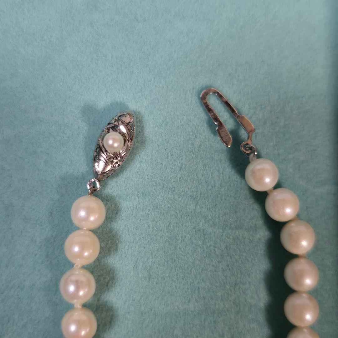 Long Akoya pearl necklace with 6mm genuine pearls on a silver chain measuring 116 cm