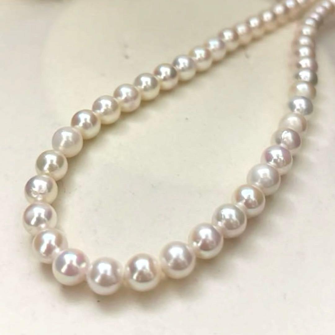 Aurora interference color Akoya pearl necklace and matching earrings with round white pearls and silver accents