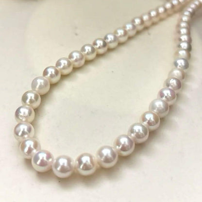 Aurora interference color Akoya pearl necklace and matching earrings with round white pearls and silver accents