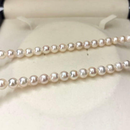 Aurora interference color Akoya pearl necklace and matching earrings with round white pearls and silver accents