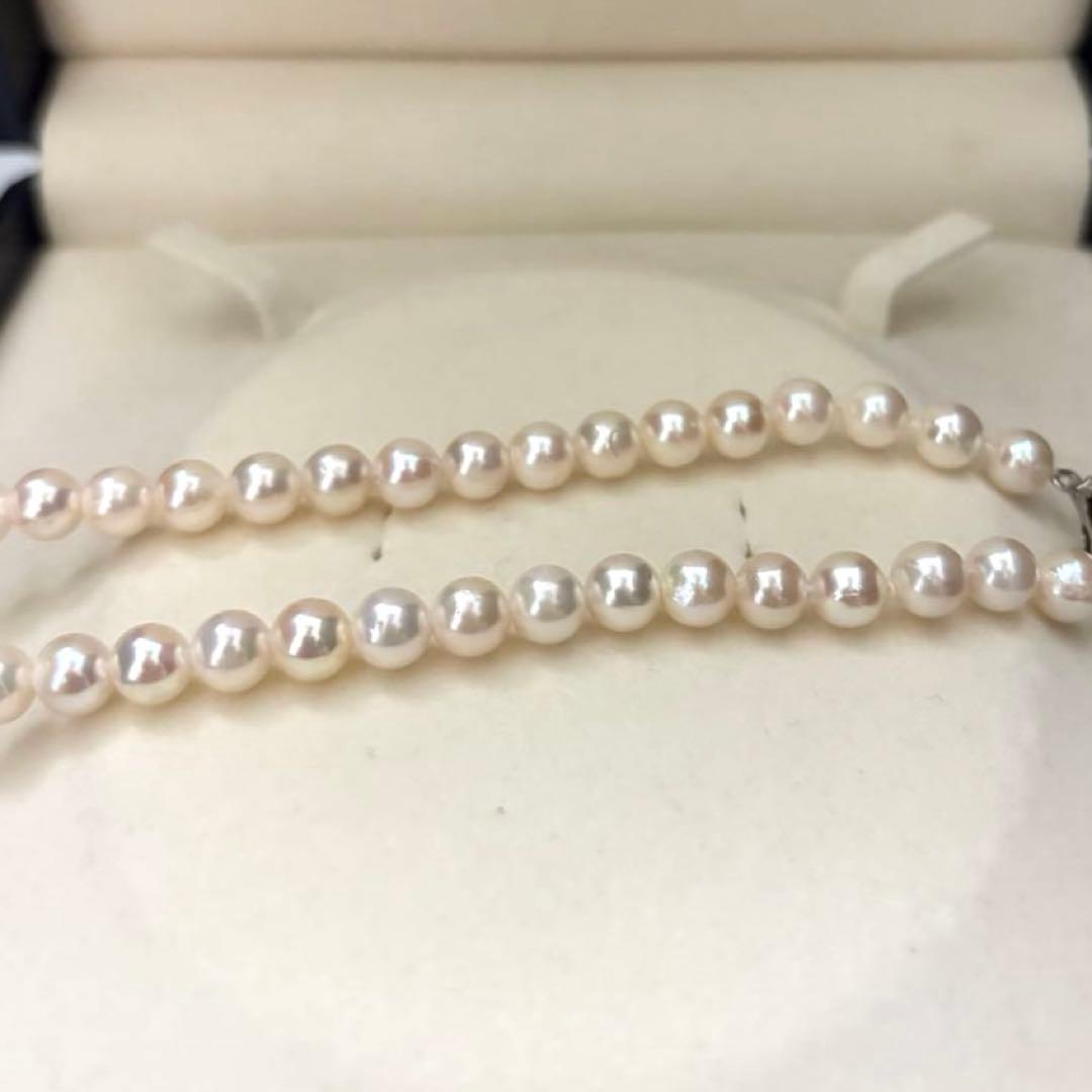 Aurora interference color Akoya pearl necklace and matching earrings with round white pearls and silver accents