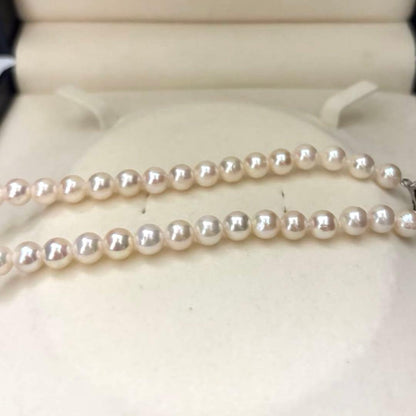 Aurora interference color Akoya pearl necklace and matching earrings with round white pearls and silver accents