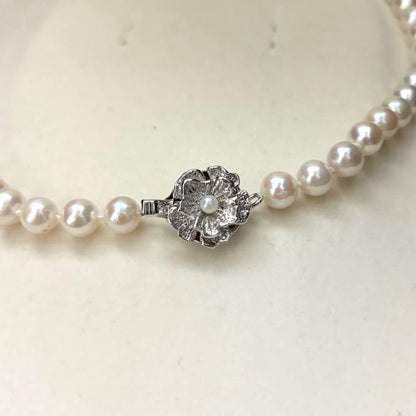 Aurora interference color Akoya pearl necklace and matching earrings with round white pearls and silver accents