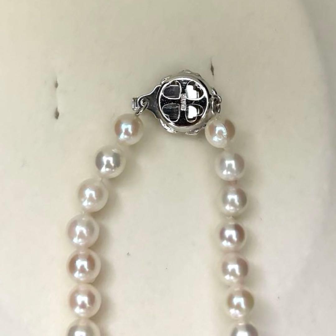 Aurora interference color Akoya pearl necklace and matching earrings with round white pearls and silver accents