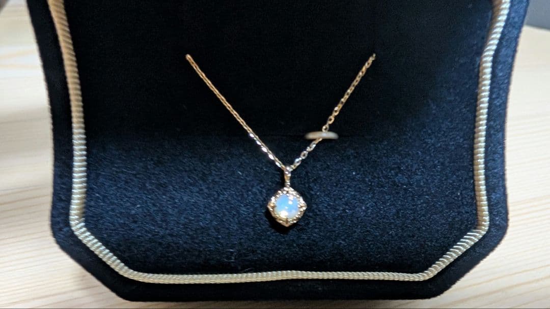 Enel Limited Edition K10 necklace featuring opal and diamond with 40cm length and delicate design