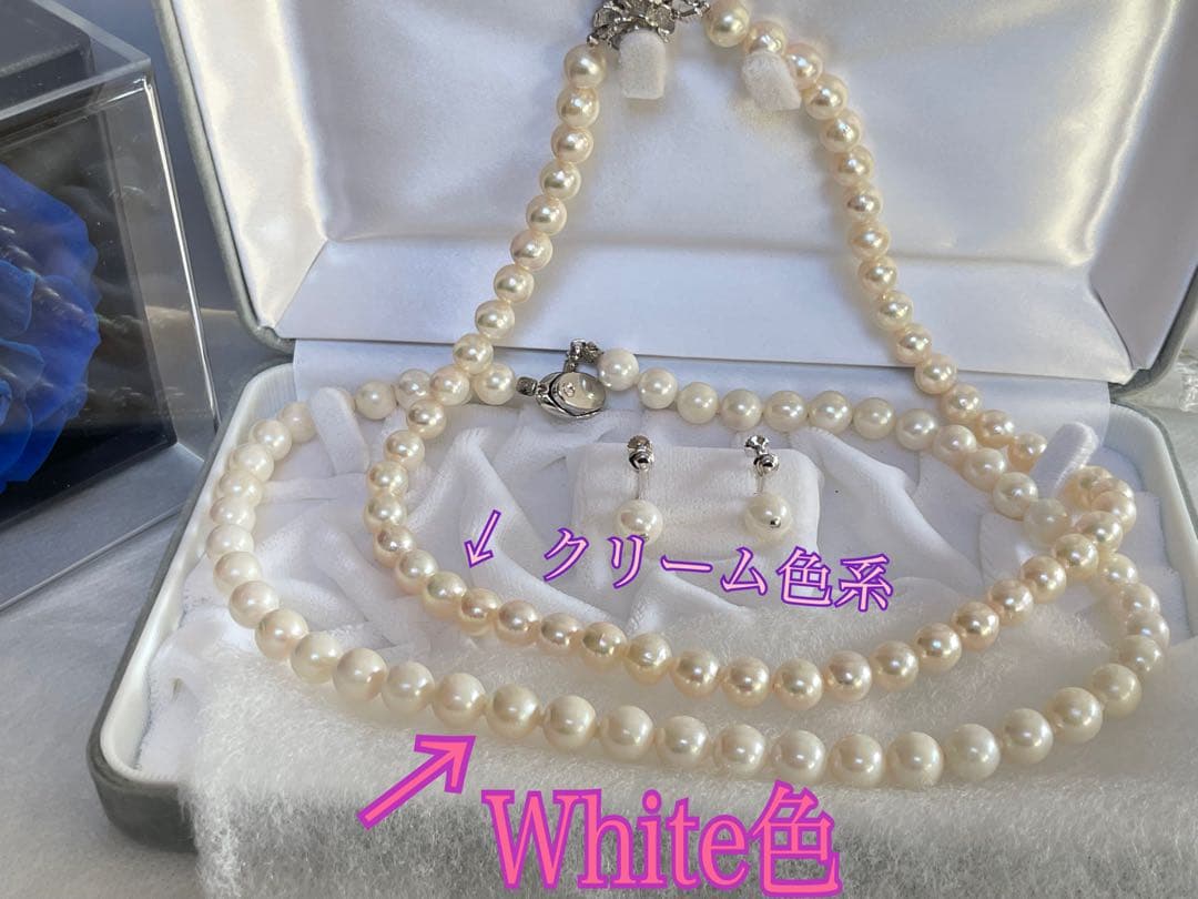 8.5mm Akoya pearl necklace with silver clasp and matching round pearl earrings featuring exposed flesh markings