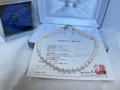 8.5mm Akoya pearl necklace with silver clasp and matching round pearl earrings featuring exposed flesh markings