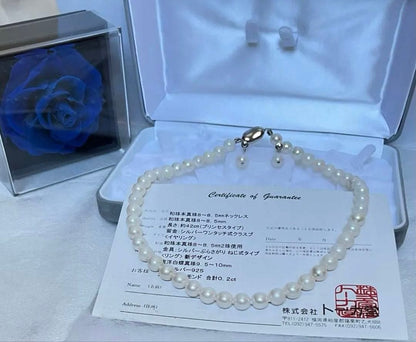 8.5mm Akoya pearl necklace with silver clasp and matching round pearl earrings featuring exposed flesh markings