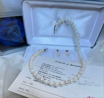 8.5mm Akoya pearl necklace with silver clasp and matching round pearl earrings featuring exposed flesh markings