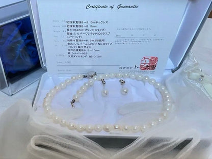 8.5mm Akoya pearl necklace with silver clasp and matching round pearl earrings featuring exposed flesh markings