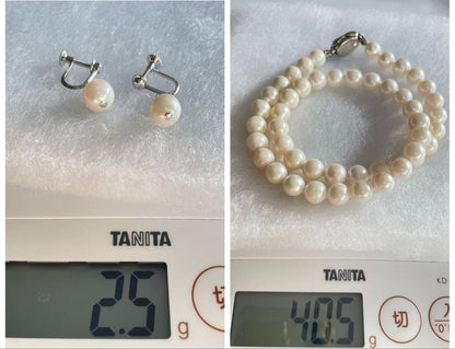 8.5mm Akoya pearl necklace with silver clasp and matching round pearl earrings featuring exposed flesh markings