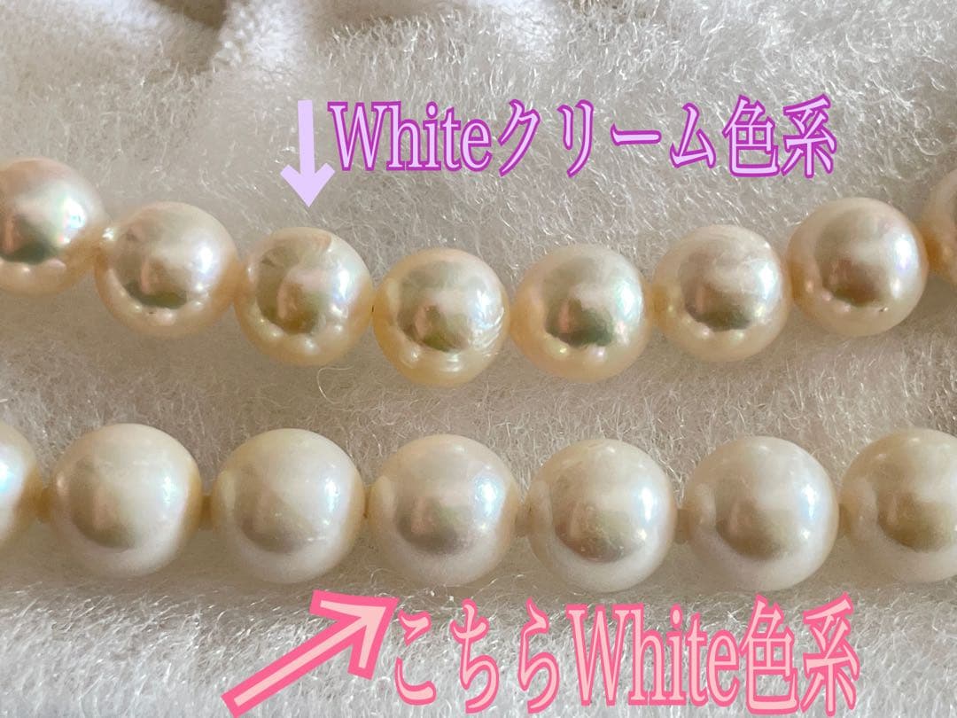 8.5mm Akoya pearl necklace with silver clasp and matching round pearl earrings featuring exposed flesh markings