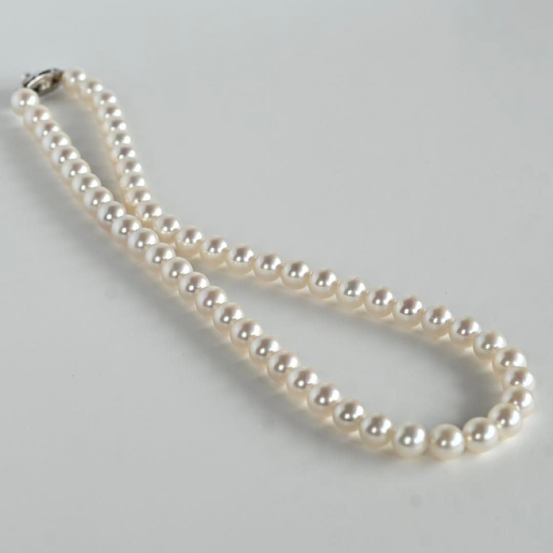 Takatsuki Akoya pearl necklace with 7.0mm round pearls and silver clasp on a white background