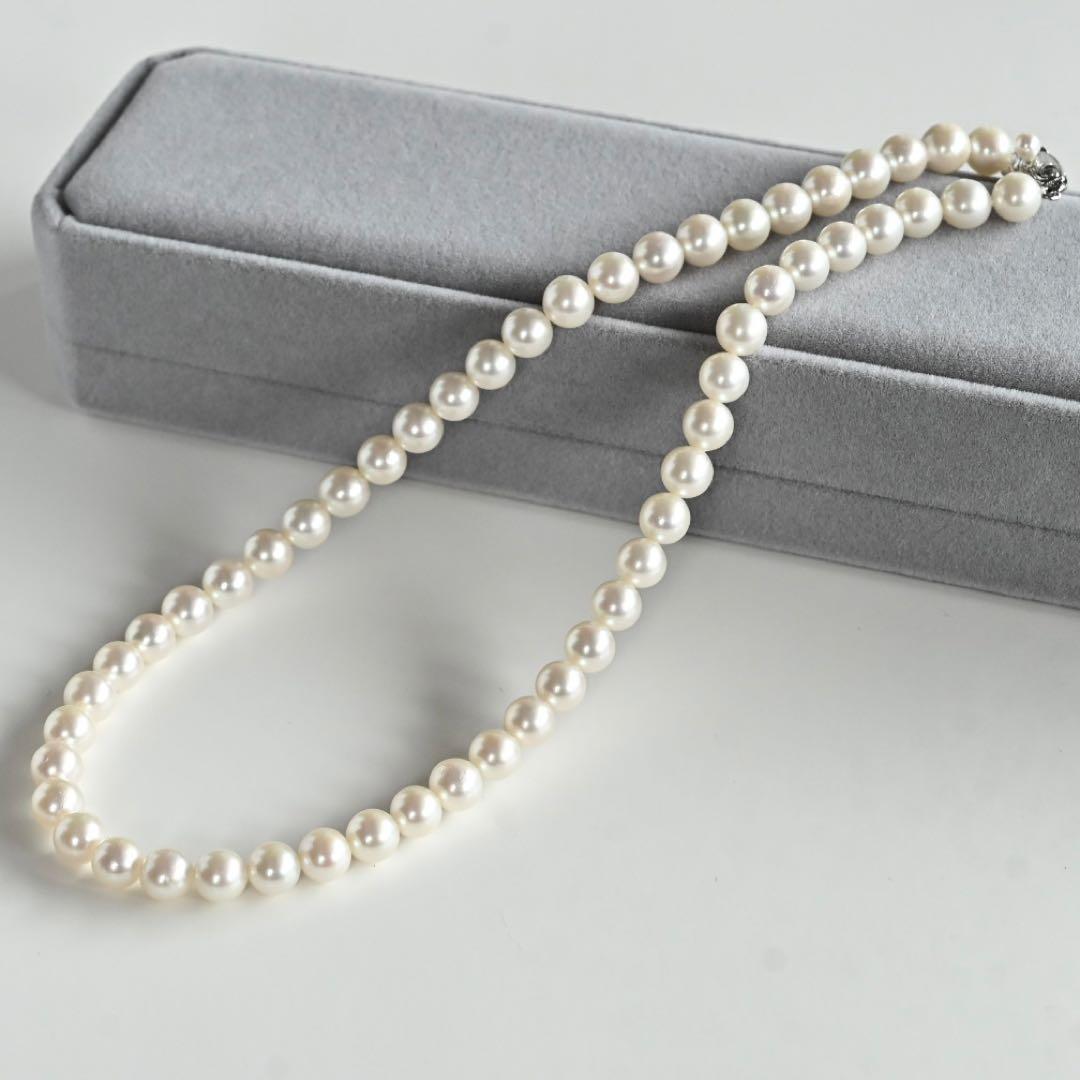 Takatsuki Akoya pearl necklace with 7.0mm round pearls and silver clasp on a white background