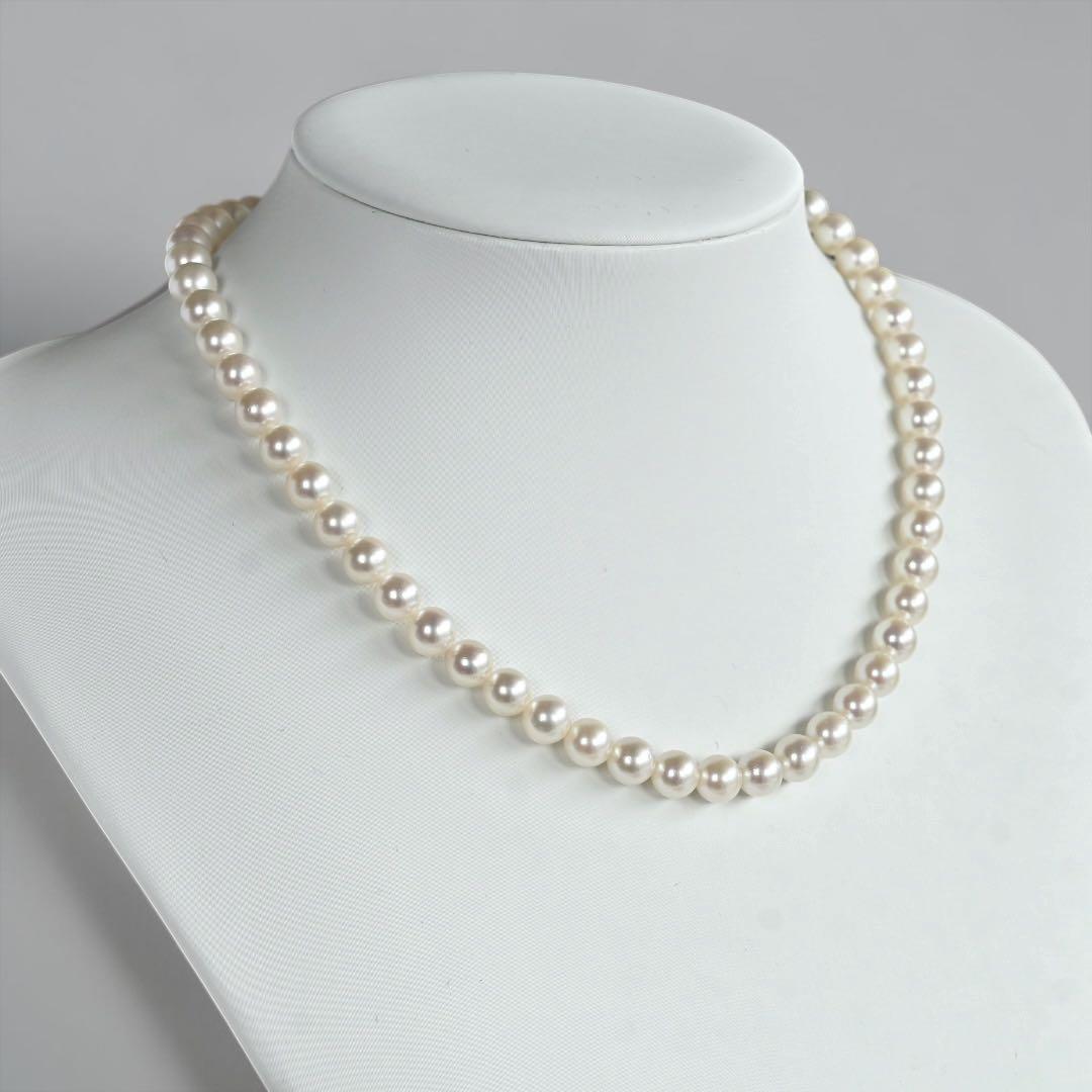 Takatsuki Akoya pearl necklace with 7.0mm round pearls and silver clasp on a white background