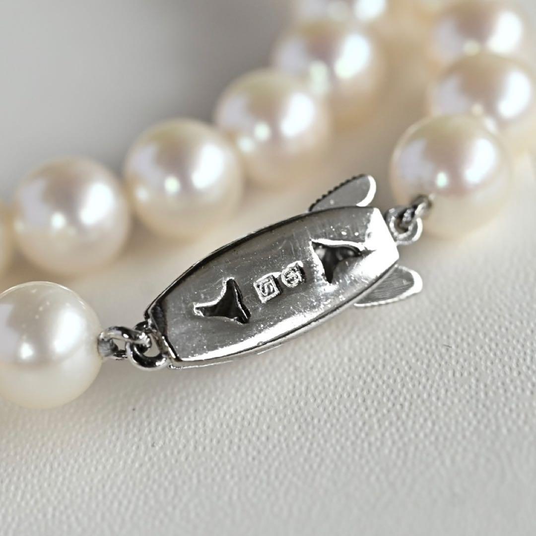 Takatsuki Akoya pearl necklace with 7.0mm round pearls and silver clasp on a white background