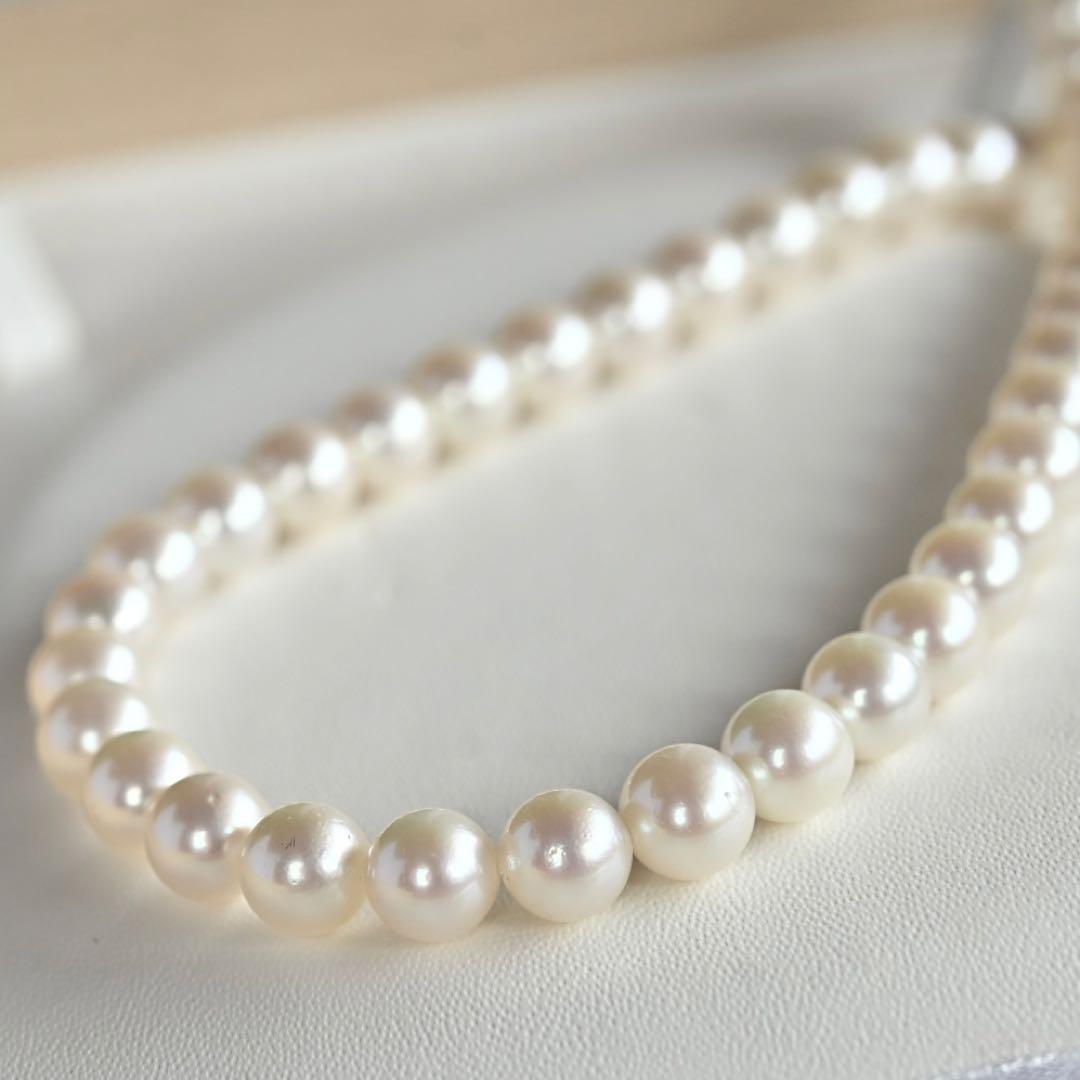 Takatsuki Akoya pearl necklace with 7.0mm round pearls and silver clasp on a white background