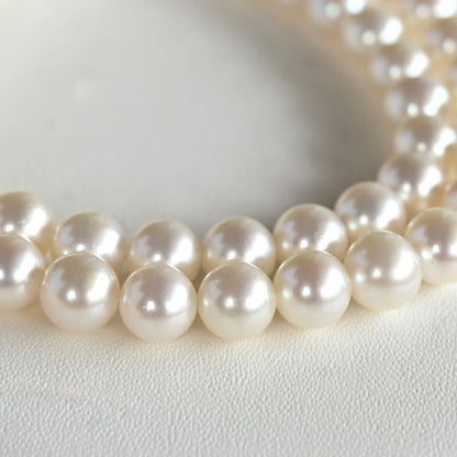 Takatsuki Akoya pearl necklace with 7.0mm round pearls and silver clasp on a white background