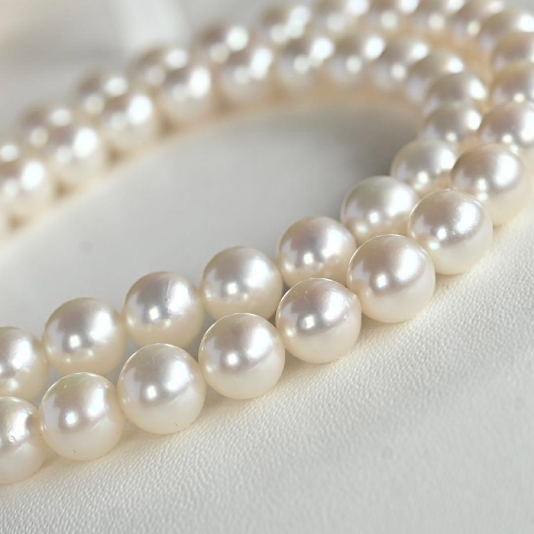 Takatsuki Akoya pearl necklace with 7.0mm round pearls and silver clasp on a white background