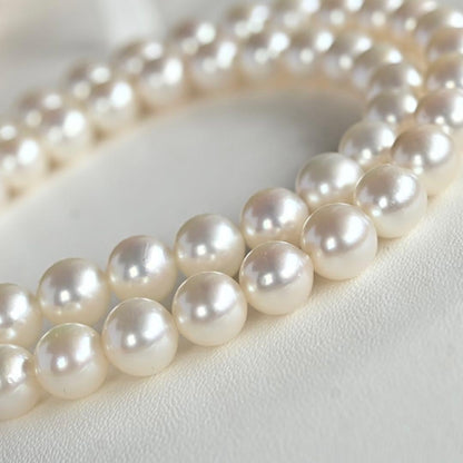 Takatsuki Akoya pearl necklace with 7.0mm round pearls and silver clasp on a white background