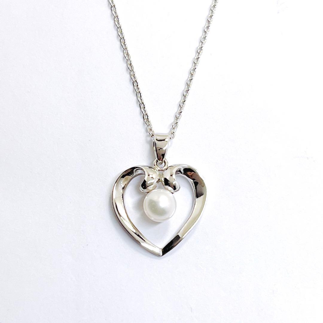 Mikimoto pearl necklace with heart motif featuring 5.4mm pearls on a 46cm silver chain