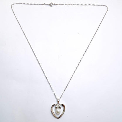 Mikimoto pearl necklace with heart motif featuring 5.4mm pearls on a 46cm silver chain