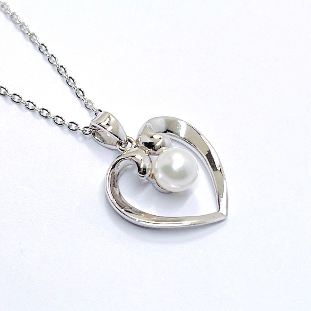 Mikimoto pearl necklace with heart motif featuring 5.4mm pearls on a 46cm silver chain