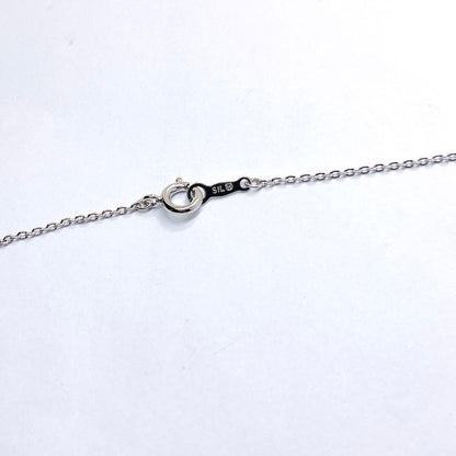 Mikimoto pearl necklace with heart motif featuring 5.4mm pearls on a 46cm silver chain